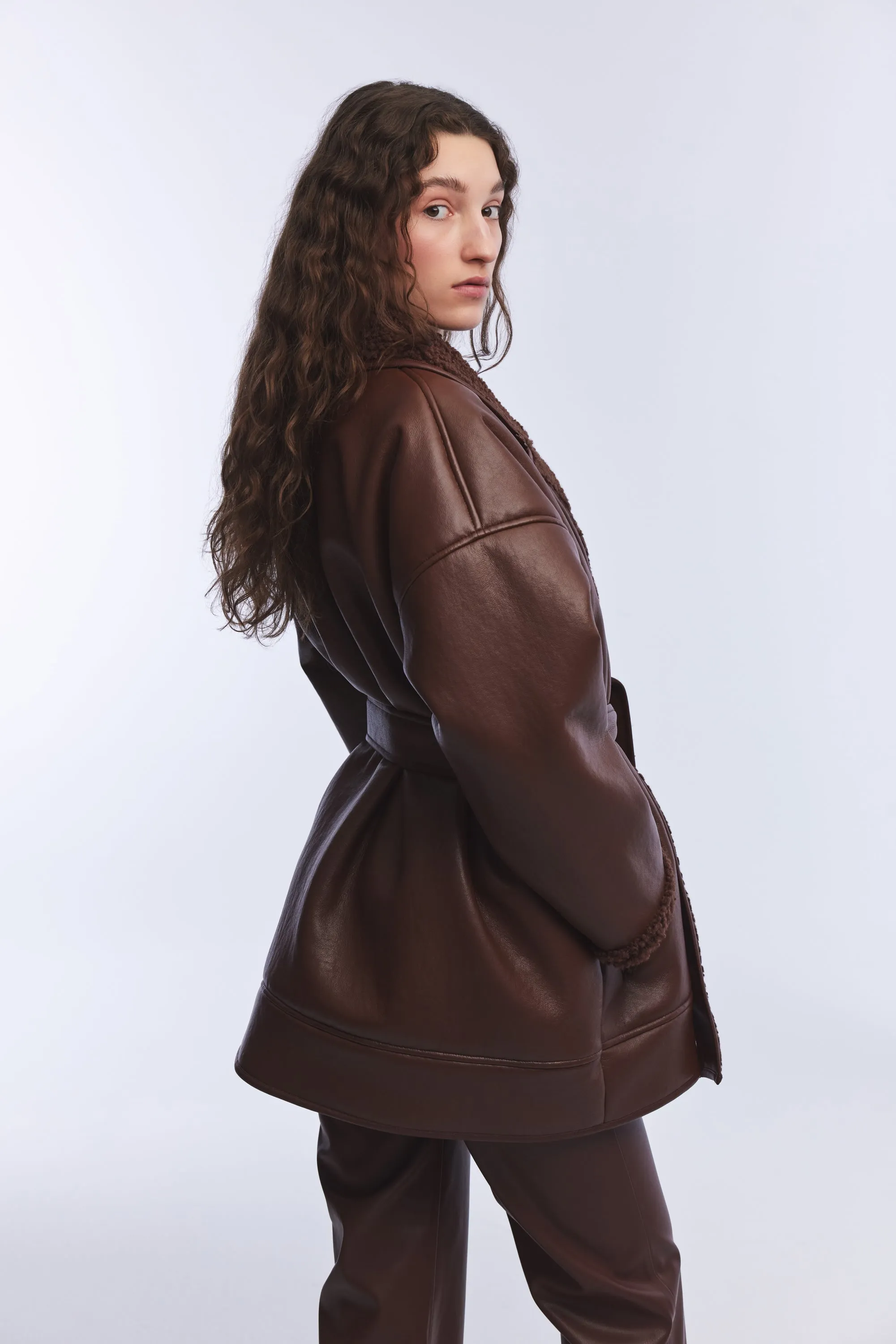 BLACK VEGAN LEATHER TEDDY DETAILED COAT WITH TIE DETAIL