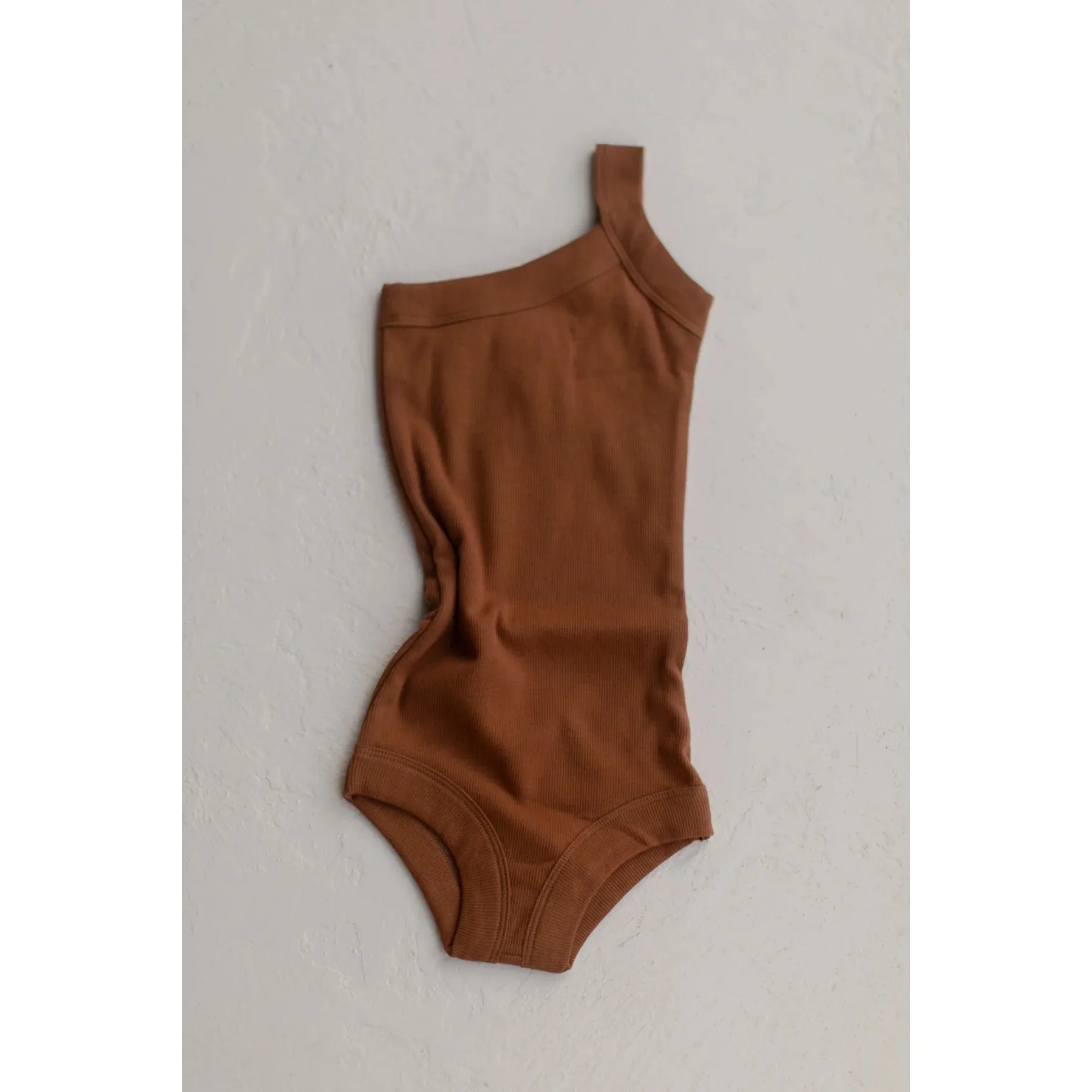 RAISED BY WATER - Shop Kai Blue x RBW: Kids One Strap Bodysuit | Kauai Clay