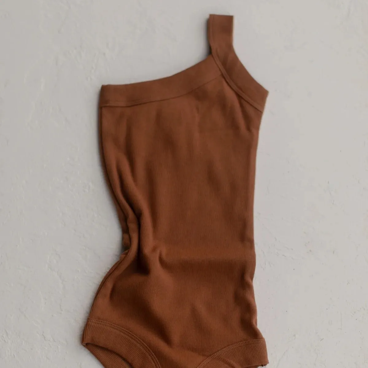 RAISED BY WATER - Shop Kai Blue x RBW: Kids One Strap Bodysuit | Kauai Clay