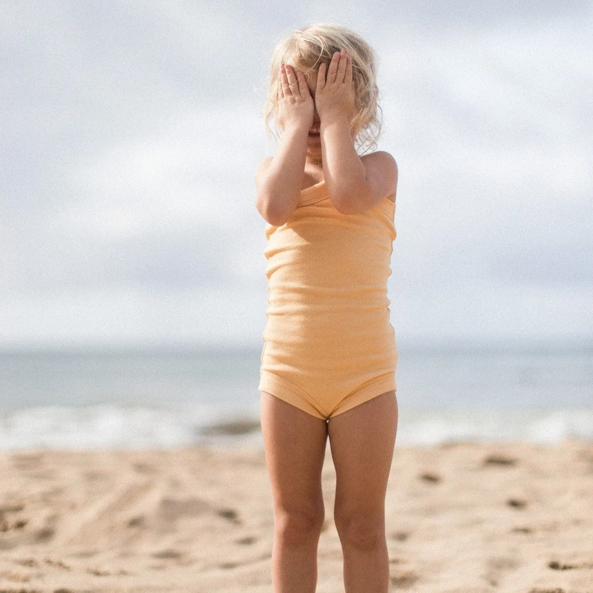 RAISED BY WATER - Shop Kai Blue x RBW: Kids One Strap Bodysuit | Peach