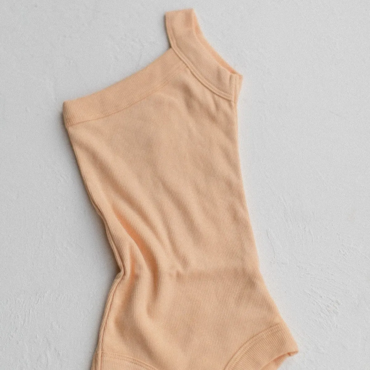 RAISED BY WATER - Shop Kai Blue x RBW: Kids One Strap Bodysuit | Peach